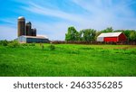 Tranquil farmland summer landscape on the green hill: The beauty of midwestern prairie in Hartford, Minnehaha County, South Dakota