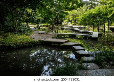 A tranquil garden with stepping stones over calm water, surrounded by vibrant greenery that invites peace - Powered by Shutterstock