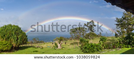 Similar – Wunderschön leuchtender Regenbogen über dem Meer