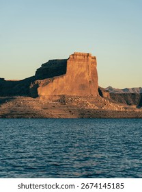The tranquil Mead lake featuring dramatic rock formations rising from the water, with small cliffs creating secluded, hidden alcoves
