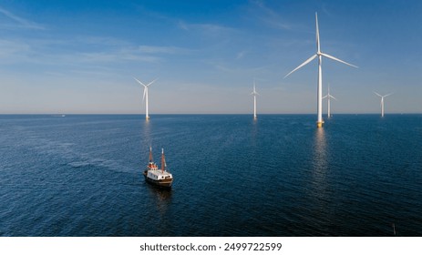 A tranquil moment captures a fishing boat gliding through the calm waters of the Ijsselmeer, framed by majestic windmills under a clear sky in the Netherlands., a fishing vessel with windmill park - Powered by Shutterstock