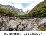 Tranquil mountain lake Mackenzie at the famous Routeburn Track, Fiordland National Park, South Island of New Zealand
