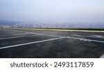 Tranquil Overlook: A Peaceful Parking Lot with Scenic City View