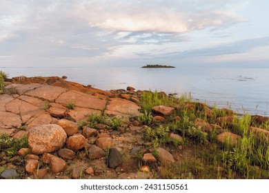 A tranquil scene by the sea on a calm summer evening, Northern Finland