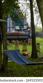 A tranquil setting with a hammock strung between trees, inviting relaxation and peaceful moments in nature