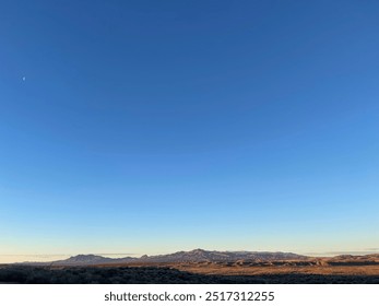 Tranquil Southwestern Desert Landscape at Twilight with Crescent Moon - Powered by Shutterstock