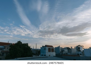 Tranquil suburban landscape at dusk, with wispy clouds in a vibrant sky and blurred light.
 Vaulted ceilings. - Powered by Shutterstock