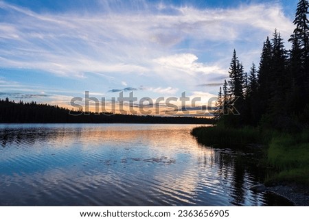 Tranquil sunset over Andy Bailey Lake, British Columbia, BC Canada