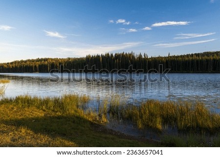 Tranquil sunset over Andy Bailey Lake, British Columbia, BC Canada