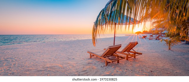 Tranquil Tropical Sunset Scenery Couple Sun Bed Loungers, Umbrella Palm Tree Leaves. White Sand Sea View Horizon, Colorful Twilight Sky, Calmness Relaxation. Luxury Vacation Travel Beach Resort Hotel