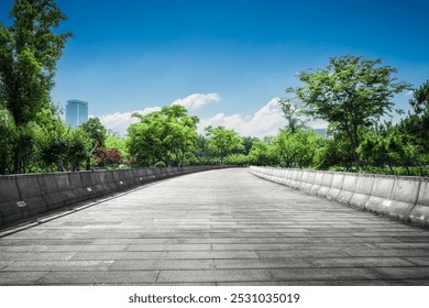 Tranquil Urban Pathway Surrounded by Lush Greenery Under a Bright Sky   - Powered by Shutterstock