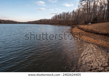 The tranquil water of Lake Michael in Burlington, North Carolina during winter