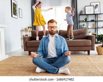 Tranquil young man in casual wear sitting on floor in lotus position and meditating while kids having fun and jumping on sofa at home
 - Powered by Shutterstock