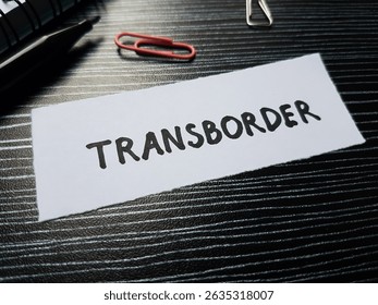 Transborder writting on table background.