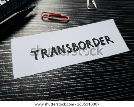 Transborder writting on table background.