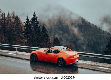 Transbucegi, Romania - December 1 2019: Mazda MX-5 ND Miata rear end shot, stop lights, wheel and exhaust details