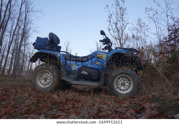Transcarpathia, Ukraine - November 26, 2019:\
CF Moto CFORCE 450 ATV blue 4x4. Quad motorbike. Extreme sport\
motion, adventure, tourist\
attraction.