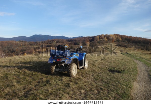 Transcarpathia, Ukraine - November 26, 2019:\
CF Moto CFORCE 450 ATV blue 4x4. Quad motorbike. Extreme sport\
motion, adventure, tourist\
attraction.