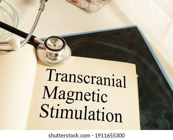 Transcranial Magnetic Stimulation TMS is shown on the photo using the text