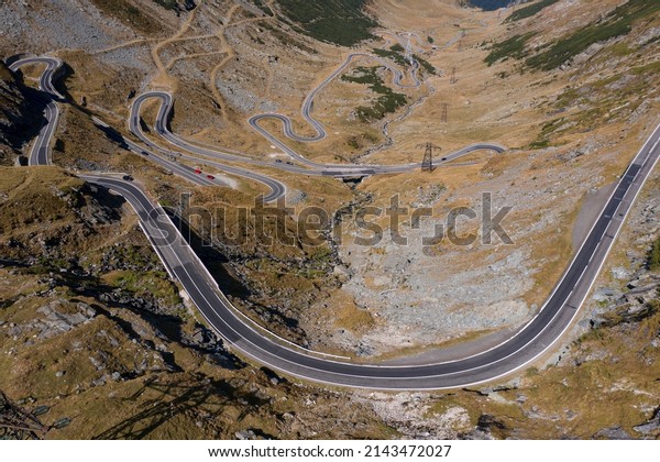 Transfagarasan Road, Romania - September 21,\
2020: It is a winding road, dotted with steep hairpin turns, long\
S-curves, and sharp\
descents.
