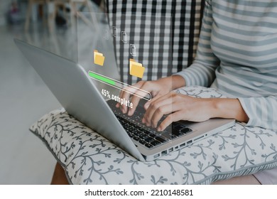 Transfer files data system relocation concept, Person hand using laptop computer waiting for transfer file process with loading bar icon on virtual screen. 