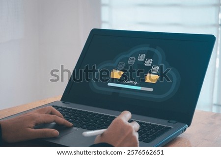 Transfer files data system relocation cloud technology concept. Backup, exchange, share. Person hand using laptop computer waiting for transfer file process with loading bar icon on virtual screen.