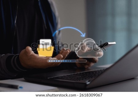 Transfer files data system relocation on cloud system technology concept. Business man hand using laptop computer waiting for AI transfer document file process with loading bar icon on virtual screen.