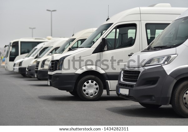 transfer shuttles and\
buses on parked in row