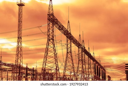 Transformer : The equipment used to raise or lower voltage, high voltage power station. High voltage electric tower on  sky  background.
