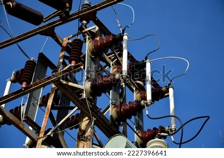 transformer with fuses against lightning strikes. glass tubes will crack in case of overvoltage. The basic parts of power transformers are the magnetic circuit, the winding and the cooling oil system 商業照片 © 
