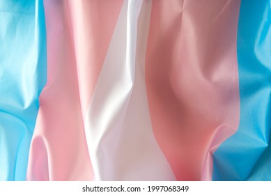 Transgender Fabric Flag With White, Pink, Blue Strips. Close-up Transgender Pride Flag As Background Or Texture	
