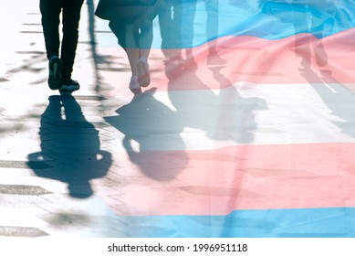 Transgender flag, shadows and silhouettes of people on a road, conceptual picture about anonymous Transgender and Gay Lesbian in the World