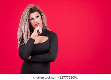 Transgender person with hand on chin and thoughtful expression