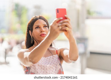 Transgender Woman Taking A Selfie Outdoors. Close Up