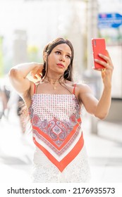 Transgender Woman Taking A Selfie While Posing Sensual Outdoors