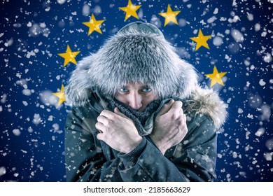 Transition to renewable energy sources. Energy crisis in Europe. A citizen of Europe freezes in front of the flag. Increase in the price of natural gas for home heating. - Shutterstock ID 2185663629