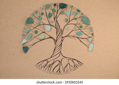 Transitory art arrangement - tree drawn on craft paper and and assortment of seaglass collected on beaches of Gran Canaria, 
representing seasonal change
