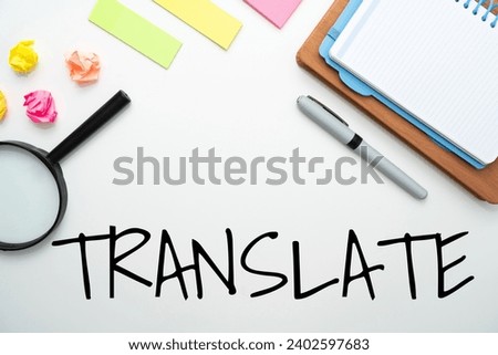 A TRANSLATE text on white background with office and school supplies