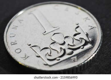 Translation: 1 Czech crown. National currency of Czechia. Czech one crown coin closeup. Illustration for news about banking or finance. Macro