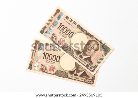 Translation: 10,000 yen, Bank of Japan note, Bank of Japan, National Printing Bureau production, Eiichi Shibusawa
10,000 yen bill on a white background.