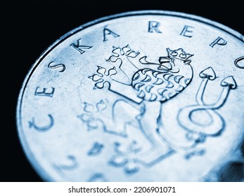 Translation: Czech Republic. Central bank of Czechia. Czech 1 one crown coin. Double-tailed lion closeup. Blue tinted illustration for news about economy or money. Currency and inflation. Macro