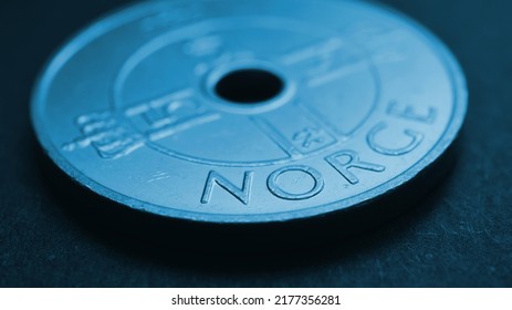 Translation: Norway. 1 Norwegian Krone Coin Closeup. National Currency Of Norway. Blue Tinted Money Wallpaper About Economy Or Finance. Bank And Loan. Savings And Interest. Kroner And Norges Bank