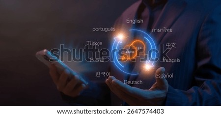 Translator app, language course and e-learning concept for translate worldwide language conversation. Businessman using translator app on smartphone to show translation icon on virtual screen.