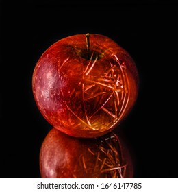 A Translucent Apple In A Black Background