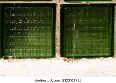 Translucent glass block wall pattern and background. Old green glass wall block from the USSR. Glass Box Wall