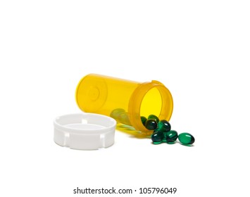 Translucent Green Prescription Pills Spilling Out Of A Bottle