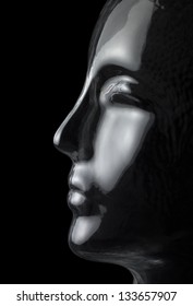translucent reflective human head made of glass in black back