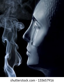 translucent reflective human head made of glass and smoke in black back