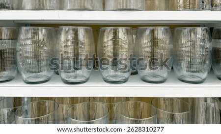Translucent ribbed glassware alignment evokes symphonic tranquility, perfect for Festivus gatherings or a Zen minimalist aesthetic celebration