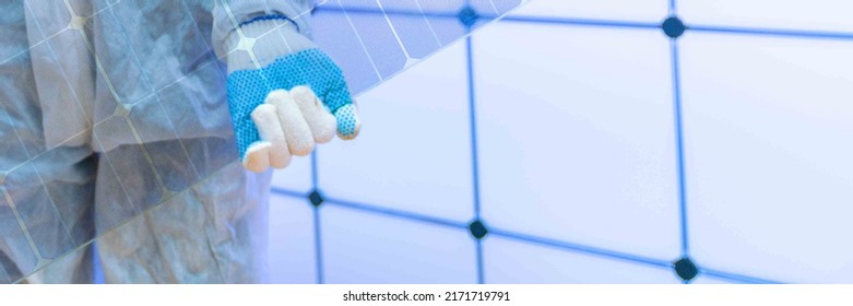Translucent solar panels for use as window glass. Photovoltaic glass is  most cutting-edge new solar panel technology that   scope of solar. Transparent solar panel in the hands of a worker